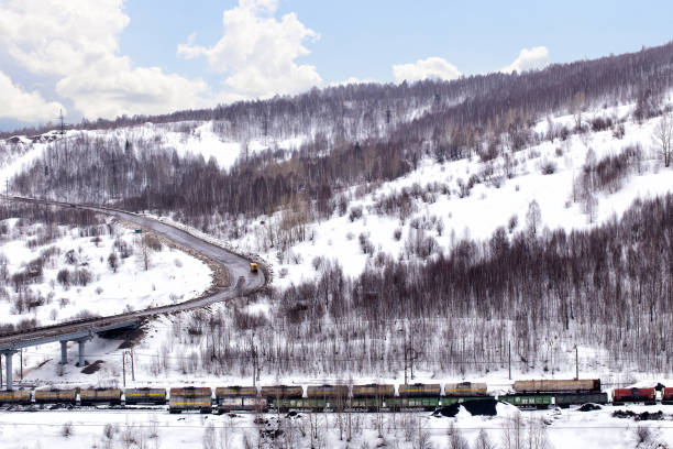 Gubaha, Russia - March 26: Road and railway through the mountain pass