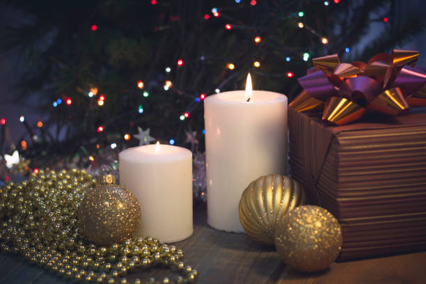 istock Still life with burning candles, Christmas decorations and a gift box 883775530