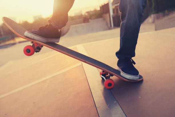 istock skateboarder legs skateboarding on skatepark ramp 883776052