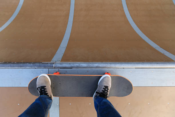 istock skateboarder legs skateboarding on skatepark ramp 883781908