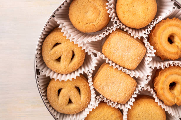 istock Closeup of Danish butter cookies in tin with copyspace 883789668