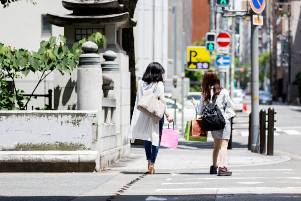 istock Friends leaving from a shopping district to catch a cab 883799470