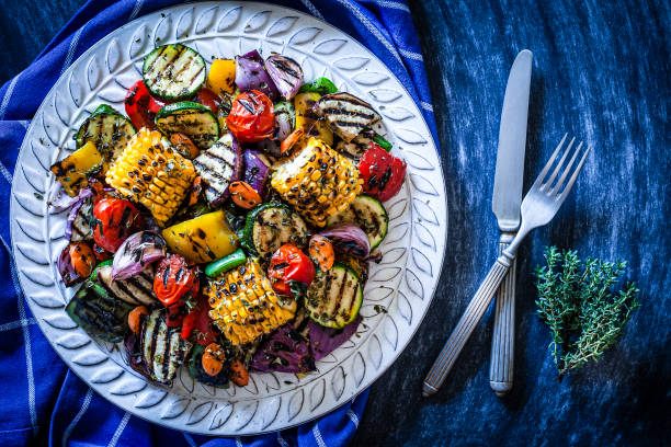 istock Grilled vegetables plate shot from above on bluish table 883799500