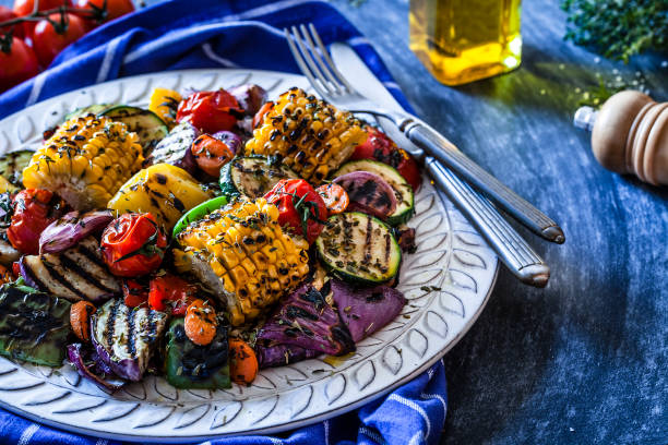 istock Grilled vegetables plate shot on bluish kitchen table 883801812