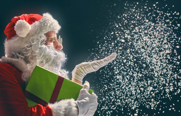 istock Santa Claus blows snow 883823850