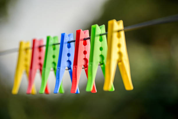 istock Colorful pegs on clothesline 883833468