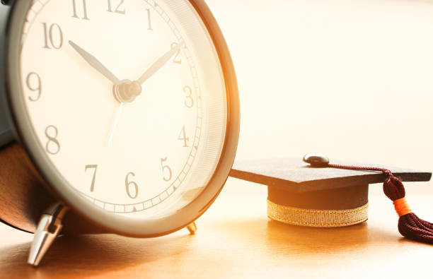 istock Closeup of Retro alarm clock with twelve o'clock. Time is indefinite continued progress of existence, events that occur in apparently irreversible succession from past through present in to the future 883833570