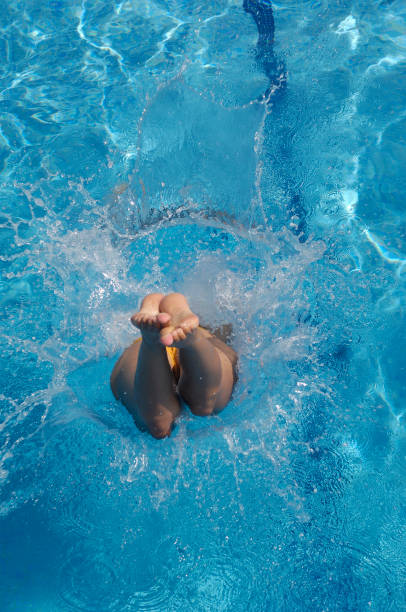 istock Woman enjoying the pool one summer day 883839674
