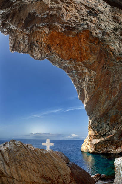 istock Cross at St. Stephan cave, in Syros island, Cyclades, Greece 883859092