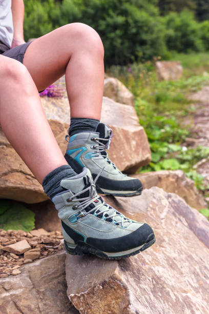 istock hiking boots on the woman legs 883872250