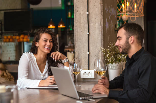 istock Two business people during work meeting in modern cafe. 883887204