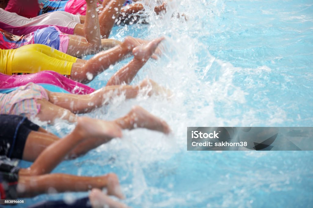 group of children at swimming pool class learning to swim Child Stock Photo