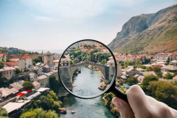 Focusing on Bosnia - Magnifying glass over the Old town of Mostar in Bosnia & Herzegovina