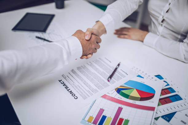 istock Business people handshake after signing the contract 883897378
