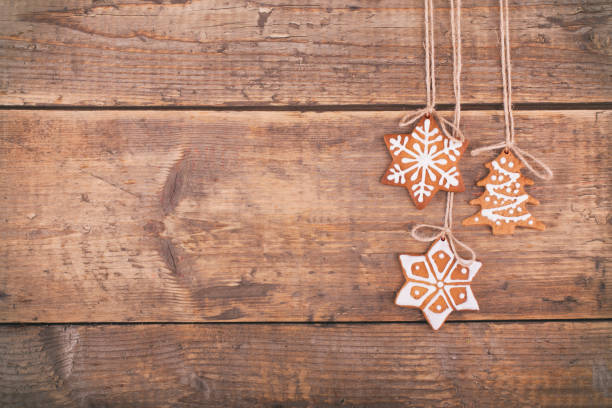 istock Christmas gingerbread cookies on wood rustic background 883897512