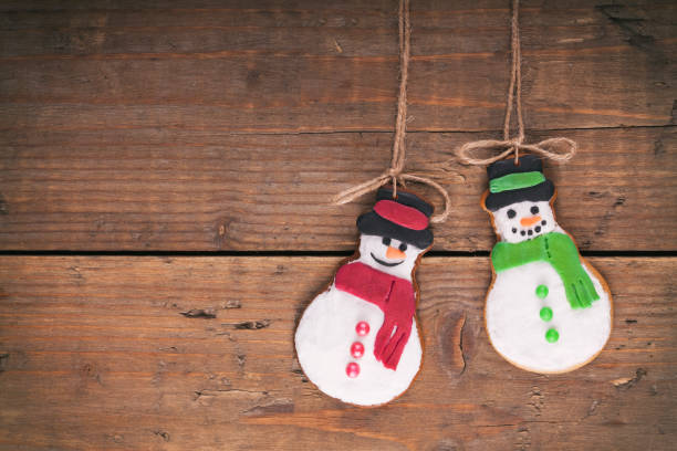 istock Christmas gingerbread cookies on wood rustic background. 883898016
