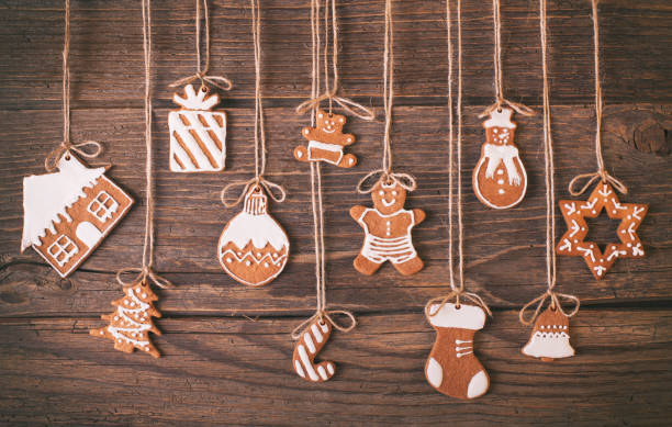 istock Christmas gingerbread cookies on wood rustic background 883919370