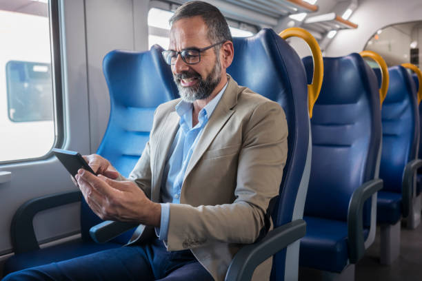 istock Mature businessman in train 883945602