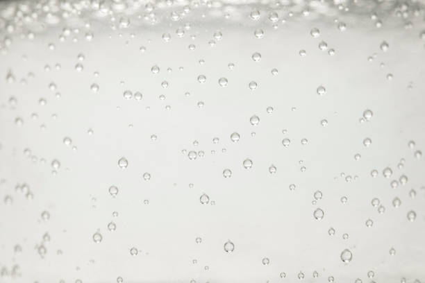 istock close up view of mineral water with bubbles 883953216