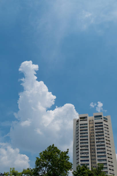 istock Beautiful storm sky with clouds in city Thailand. (selective focus) 883963346