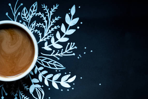 piece of cake and a cup of coffee on a black background decorated painted white snowflake. piece of cake and a cup of coffee on a black background decorated with New Year. painted white snowflake. новая компания stock pictures, royalty-free photos & images