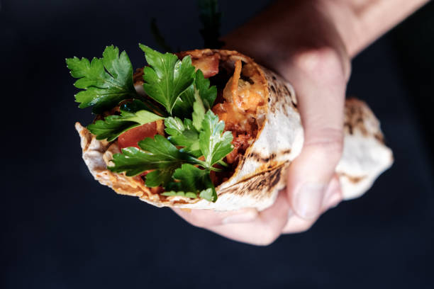 istock Veggie sweet potatoes burger with tofu, held in hands 883977568