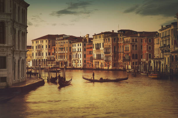 Canals of Venice, Italy Venice is a city in northeastern Italy and the capital of the Veneto region. It is situated across a group of 118 small islands that are separated by canals. gondola traditional boat photos stock pictures, royalty-free photos & images
