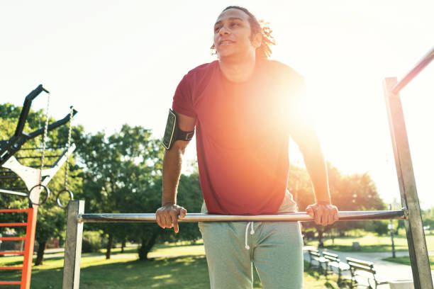 istock Attractive man training in the park 883978248
