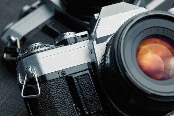 istock Old vintage film cameras on canvas 883978998