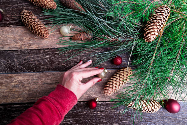 istock Female Hand Decorate Christmas or New Year Composition. Flat Lay 883990310
