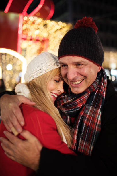 istock Happy middle aged couple on Christmas time 883991224