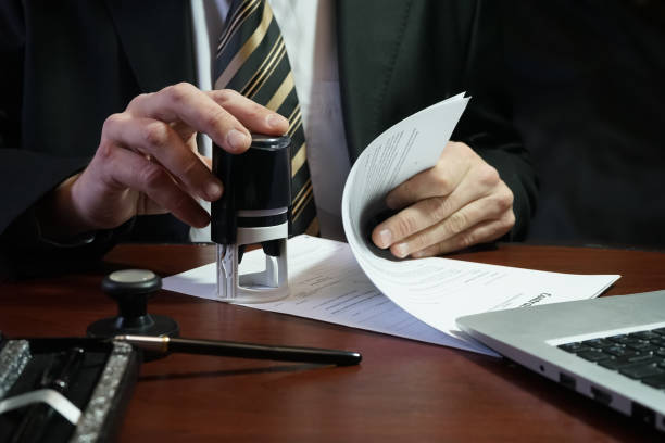 istock The businessman puts a stamp on the contract 883991402