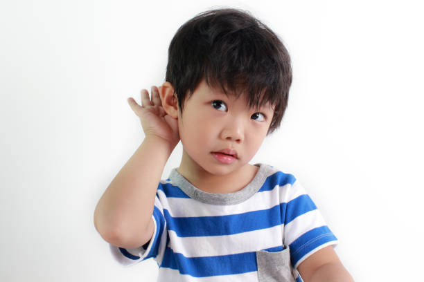 kid with hearing problem - young ears imagens e fotografias de stock