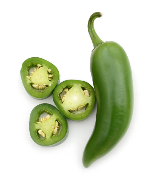 istock green jalapeno peppers with half slice isolated on a white background 884000698