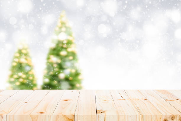 istock Wood table top on white bokeh abstract background 884000728