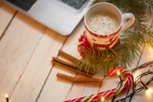 istock Freelancer's working place at home decorated for Christmas holiday 884001104