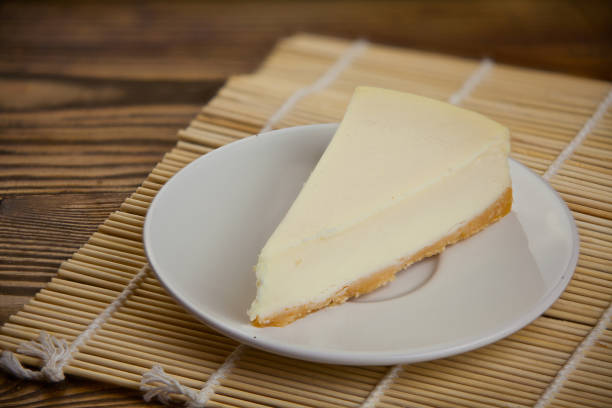 istock classic cheesecake on white plate on  wooden table 884003500