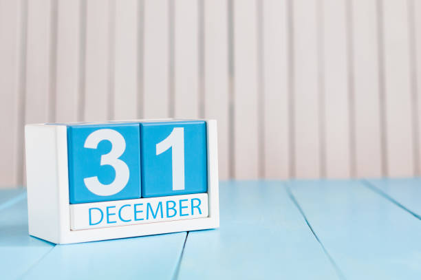 December 31st. Day 31 of month, calendar on wooden background. New year at work concept. Winter time. Empty space for text December 31st. Day 31 of month, calendar on wooden background. New year at work concept. Winter time. Empty space for text. december 31 stock pictures, royalty-free photos & images