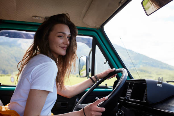 istock Young woman camper driver. 884008646