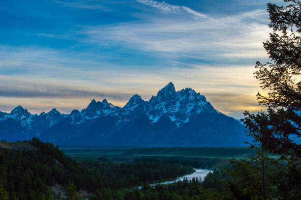 Cloudy sky over Grand Tetons stock photo