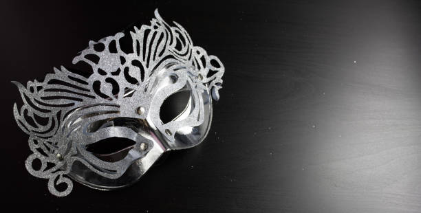 istock Silver mardi gras mask , Placed on a Black background. 884011334
