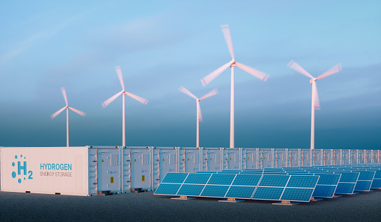Power to gas concept in nice morning light. Hydrogen energy storage with renewable energy sources - photovoltaic and wind turbine power plant farm. 3d rendering.