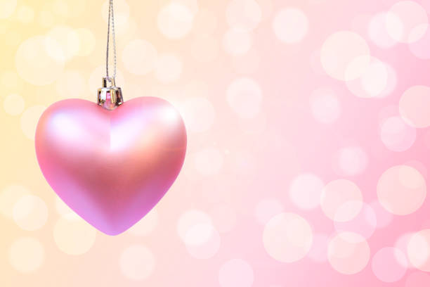 istock pink heart on blur bokeh pastel 884012366