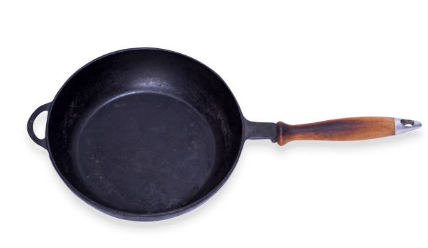 istock empty round cast iron frying pan with wooden handle 884015748