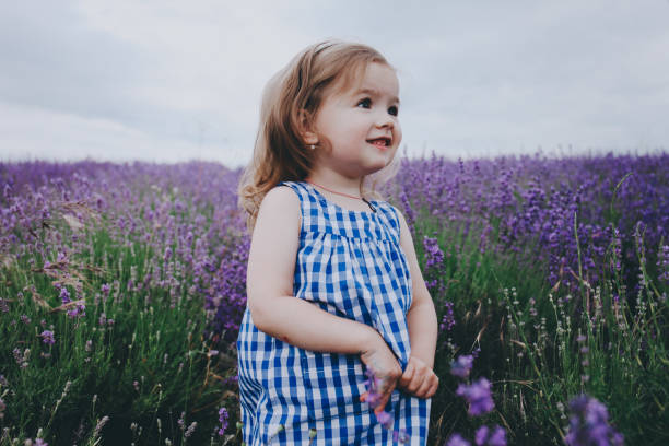 istock Little smiling girl in lavender. 884018502