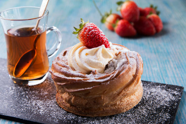 istock cake with custard and strawberries whipped cream 884018504