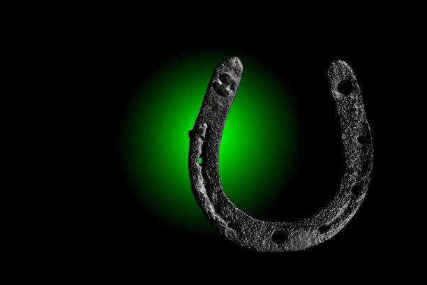 istock HorseShoe rusty steel on dark background 884019420