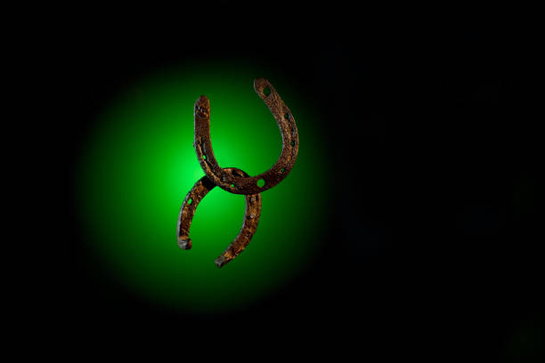 istock HorseShoe rusty steel on dark background 884019500