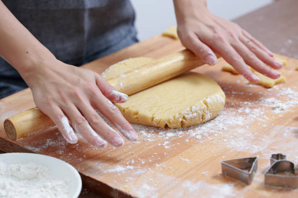 istock Female making dough for cookies 884019520