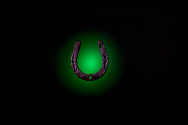 HorseShoe rusty steel on dark background